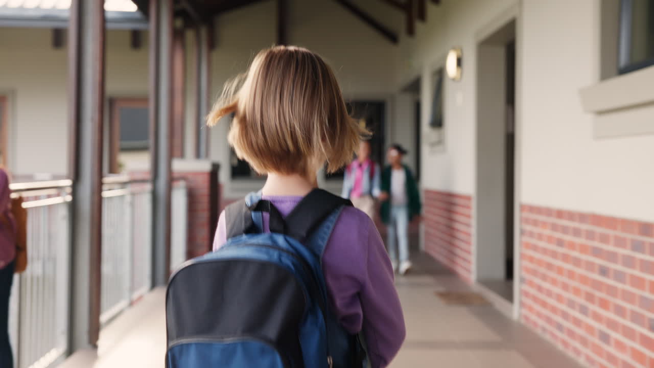 School children walking down a hallway