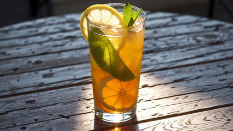 iced tea with lemon, mint, and orange slices