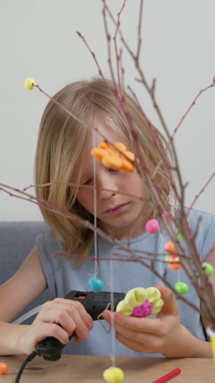 Young Girl Using Hot Glue Gun for Craft Project