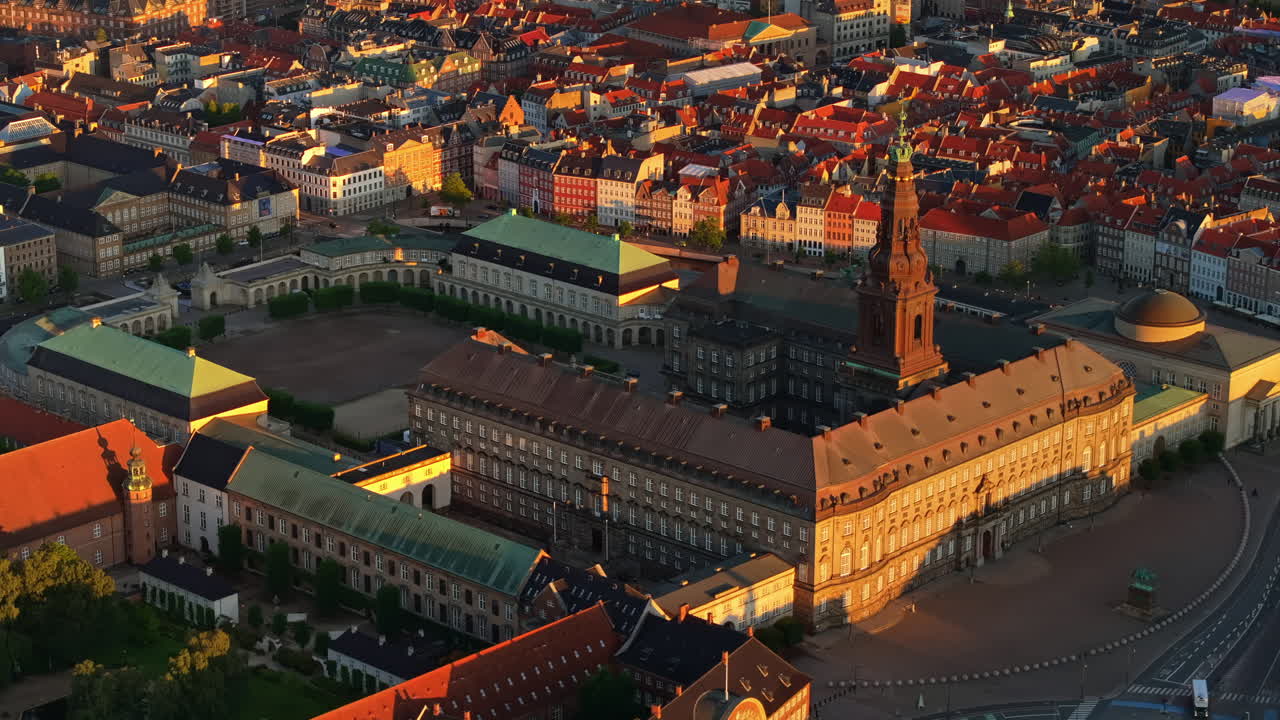 Aerial drone view of the Christiansborg Palace on the islet of Slotsholmen in central Copenhagen, Denmark at sunset