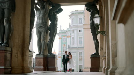 couple walking through a historic building