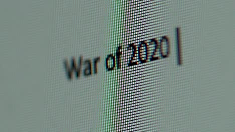 Macro-War-of-twenty-twenty-words-typing-on-a-computer-screen-extreme-close-up