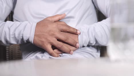 man experiencing abdominal pain