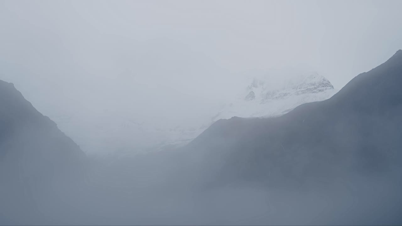 Minimalist Misty Mountain Scenery, Snowcapped Mountains in Mist in Minimalist Landscape and Nature Shot in the Himalayas Mountains in Nepal