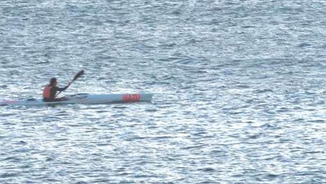 professional-man-Canoeing-very-fast-On-A-ocean-Aerial-View