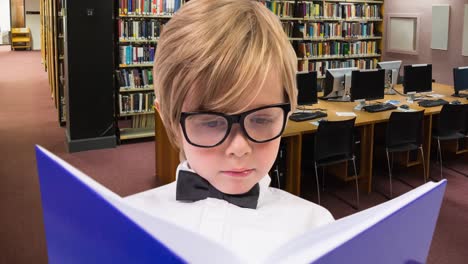 animation of caucasian boy reading book over library