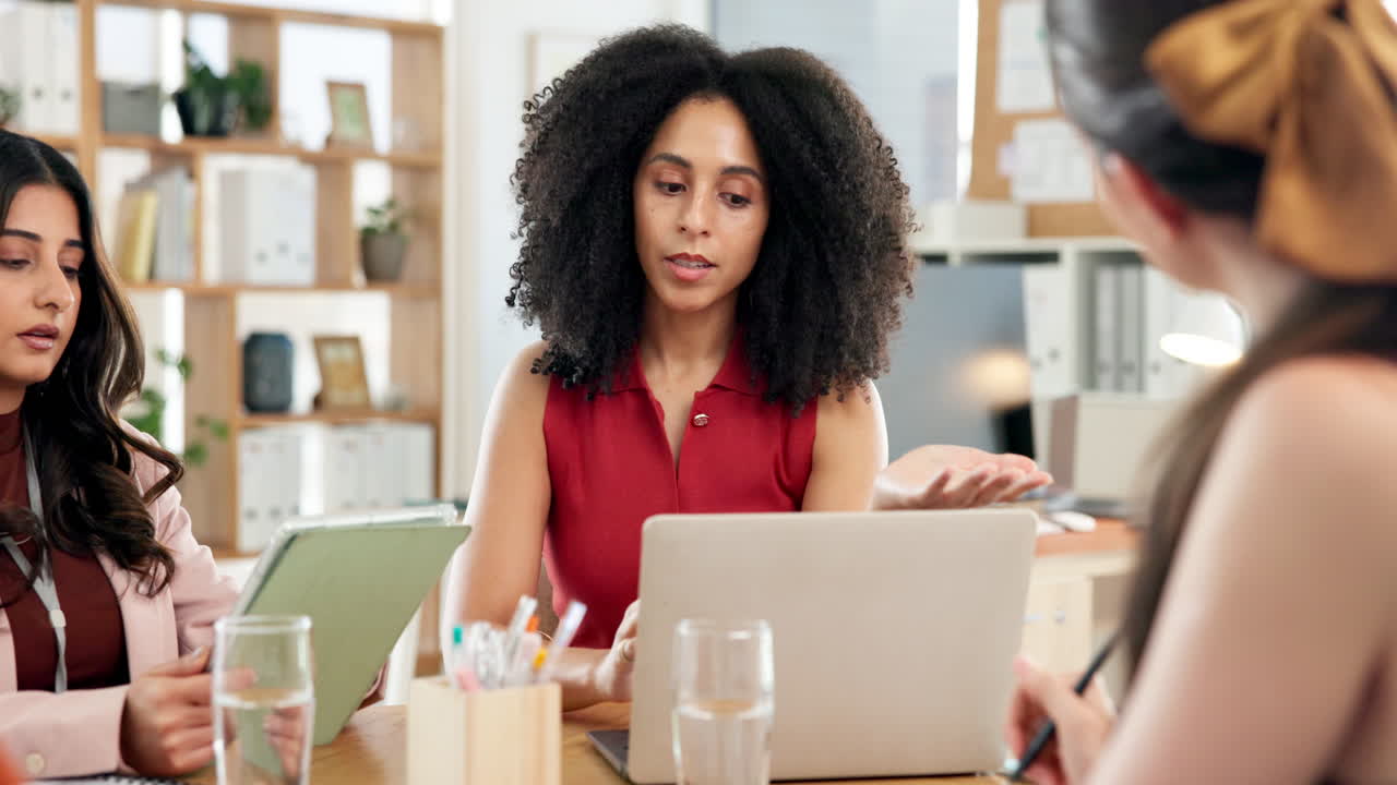 Diverse Businesswomen Discussing Ideas in a Modern Office Meeting