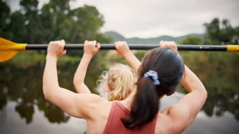 Girl,-mother-and-celebration-in-kayak-at-lake