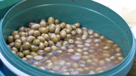 buckets of olives for sale street food market