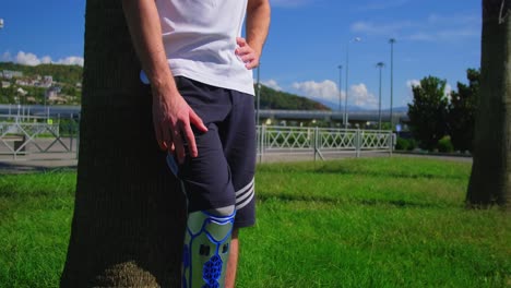 man with prosthetic leg in a park