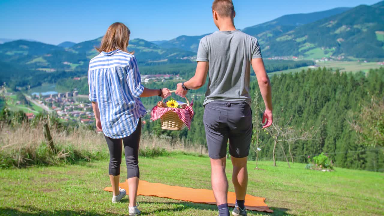 young romantic couple walk with picnic basket. Celebrate valentine's day
