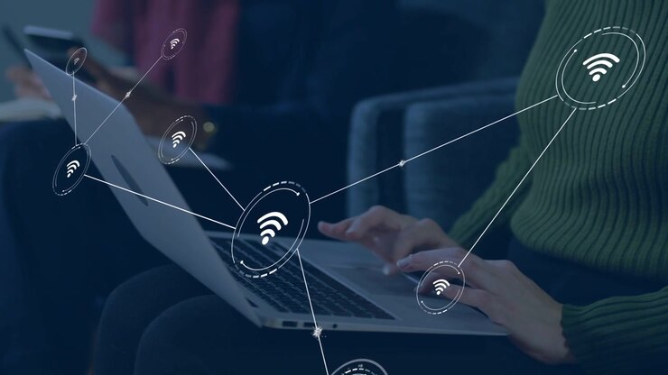 Rear woman tapping phone starting wifi overlay toward laptop as right woman typing for business