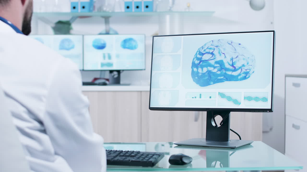 Doctor analyzing brain scan on computer