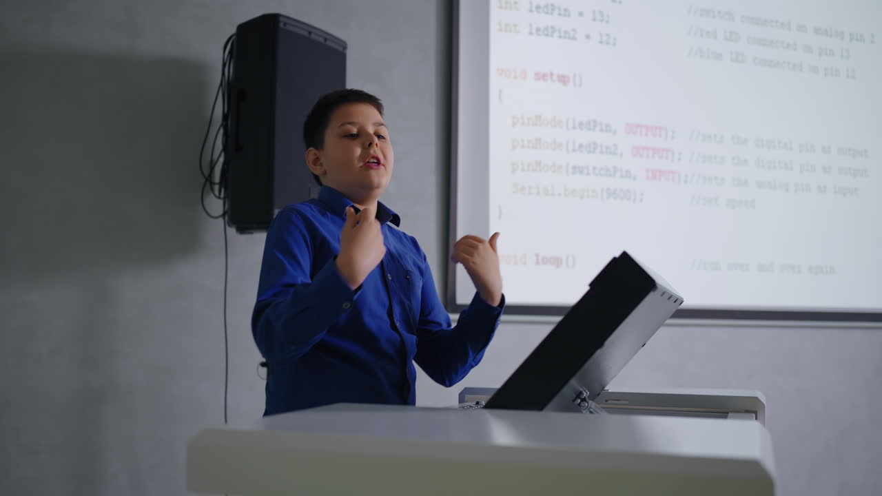 Boy Giving a Presentation on Coding