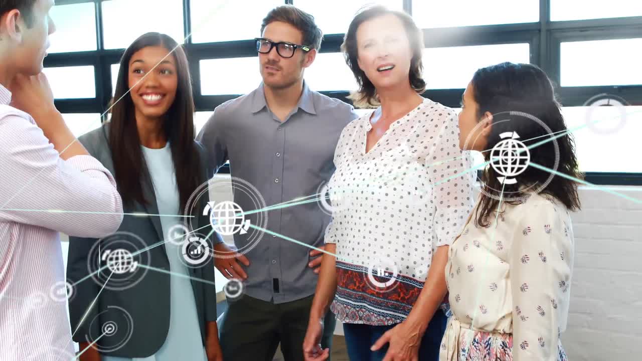 Animation of network of digital icons over diverse colleagues discussing together at office