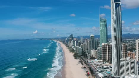 high aerial view video capturing the landmark high-rise buildings along the beach front of the surfers paradise australia