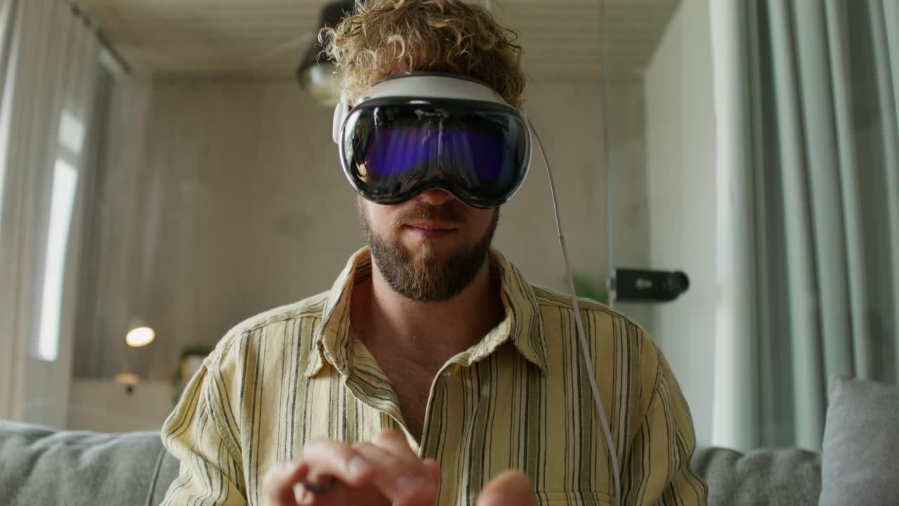 Man using VR headset at home