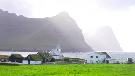 Fascinate-view-of-Vidareidi-village-covered-in-sunbeams-after-storm