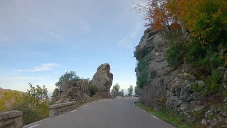 driving-through-the-Santa-Fe-Reservoir-in-Montseny-Colorful-autumn-in-the-mountain-forest-ocher-colors-red-oranges-and-yellows-dry-leaves-beautiful-images-nature-without-people