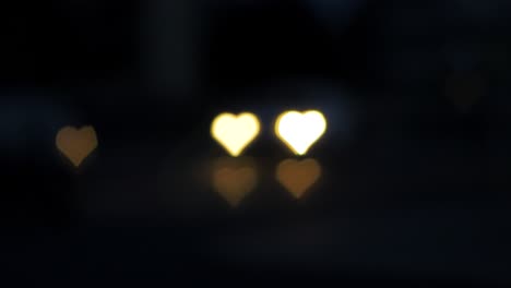 Beautiful-hearts-bokeh-from-moving-car-and-traffic-lights-at-the-evening,-Valentines-Day,-wedding-day-or-social-media-Like-background-concept