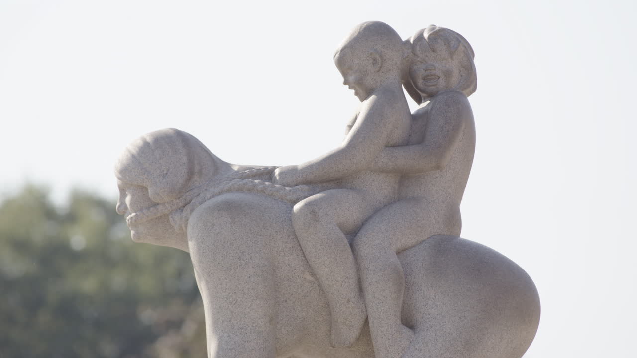Cute family sculpture of kids riding adult like a horse, Vigeland Park, Oslo