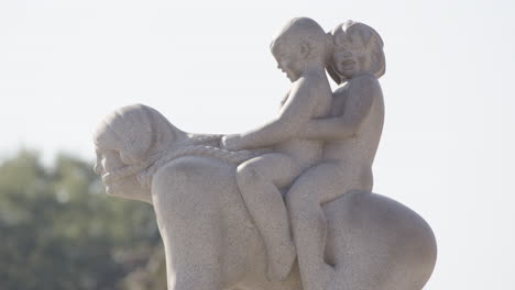 cute family sculpture of kids riding adult like a horse, vigeland park, oslo