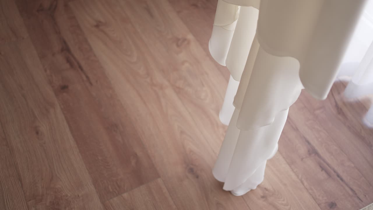 Wedding Dress on Wood Floor