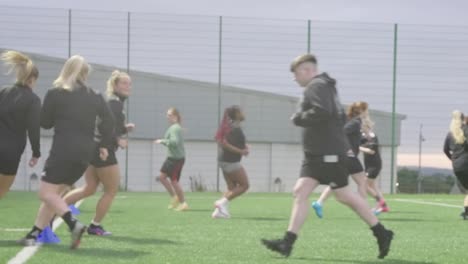 nighttime soccer practice, fitness training, women’s football team