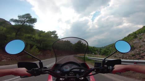 riding a motorcycle on penteli mountain in greece