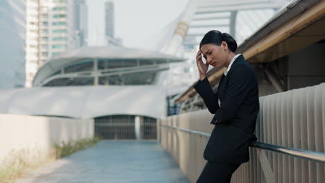 stressed businesswoman in city