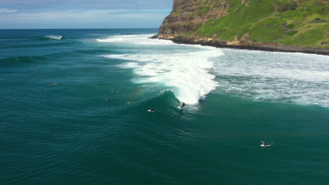 4k-Drone-shot-of-a-big-surf-wave-and-a-small-rainbow-in-Australia