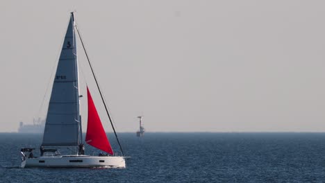 sailboat gliding across calm ocean waters