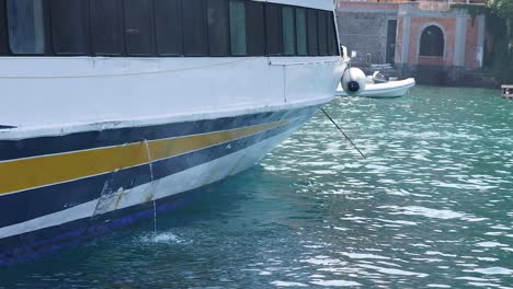 a boat approaches and docks at the pier