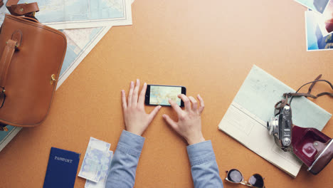 Top-view-woman-traveler-hands-planning-holiday-at-vintage-desk-from-above---Red-Epic-Dragon