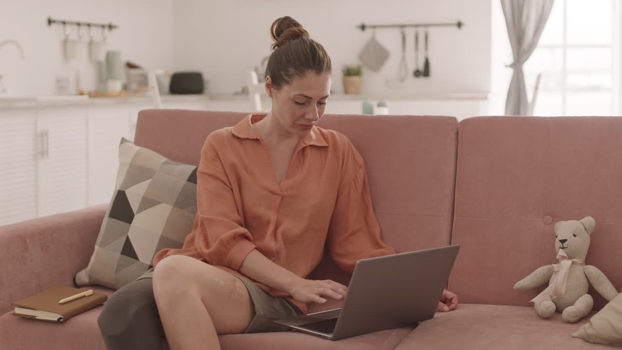 Woman with Disability Working on Laptop