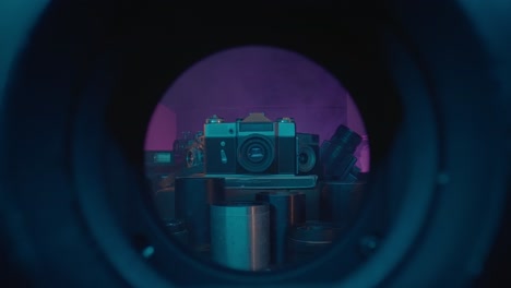 vintage camera collection under neon lights