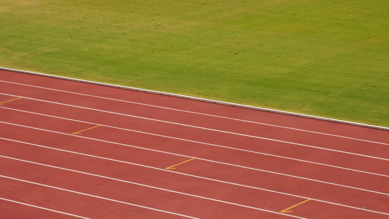 Rubberized artificial racing lane surface for track athletics, white lines and curved in the stadium