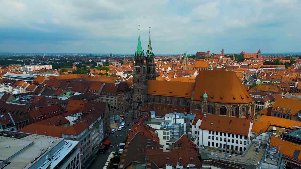 4K Aerial Drone Video of Copper-clad Spiers and Tiled Roof of St. Lawrence Church in Downtown Nurnberg, Germany
