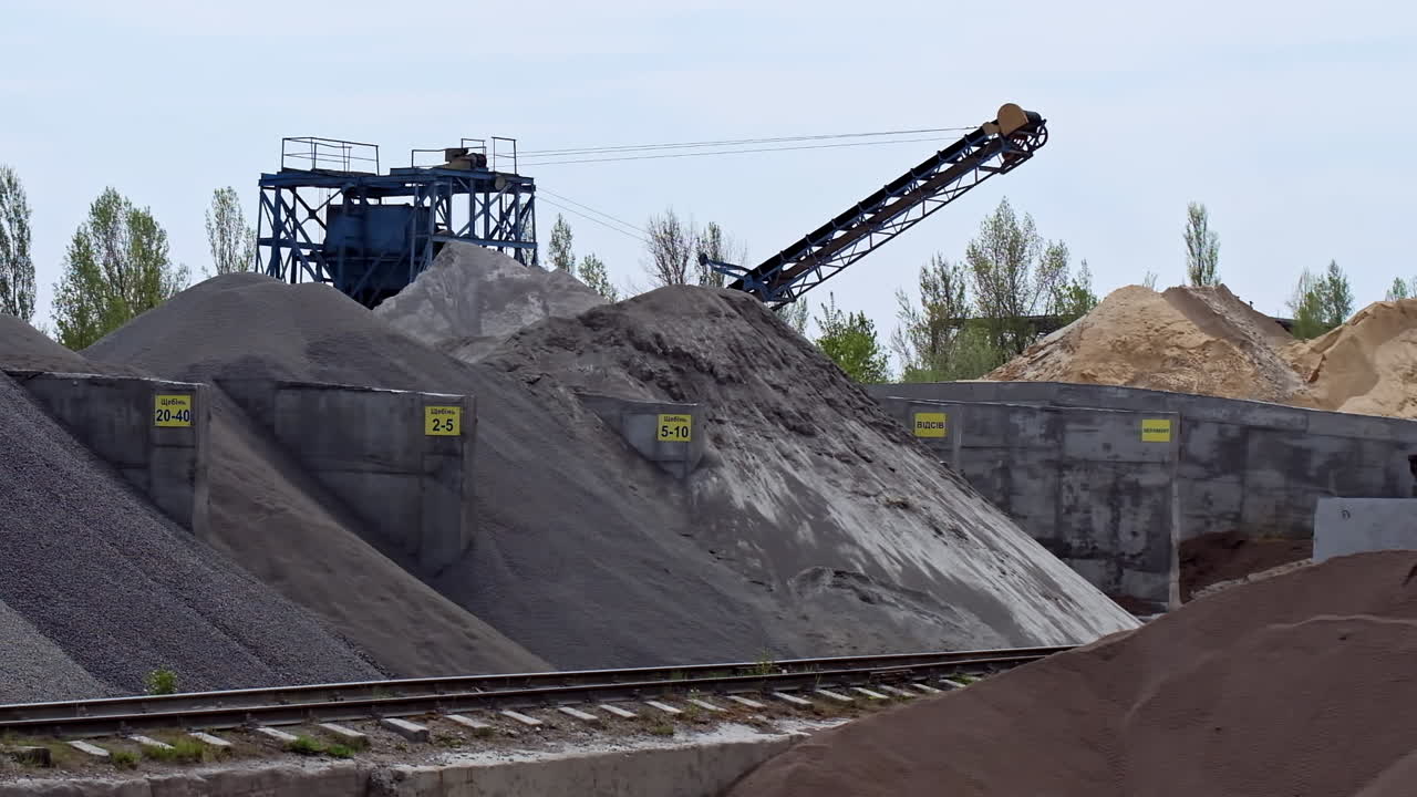Stone crushing equipment. Industrial background with working gravel crusher