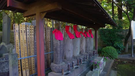 jizo guardian statues at gotoku-ji temple in tokyo japan, 4k