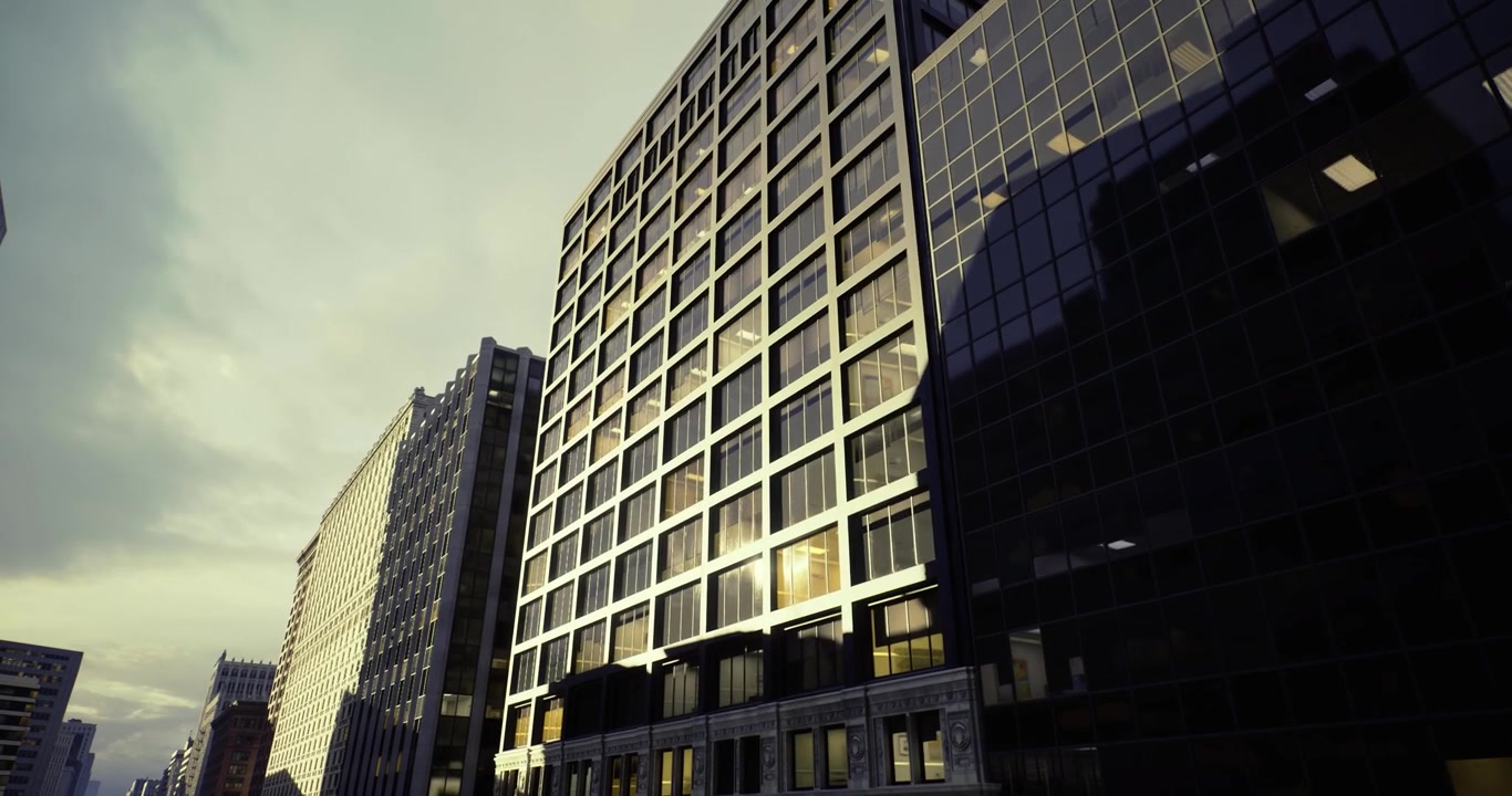 Corporate headquarters bathed in warm light during evening rush hours