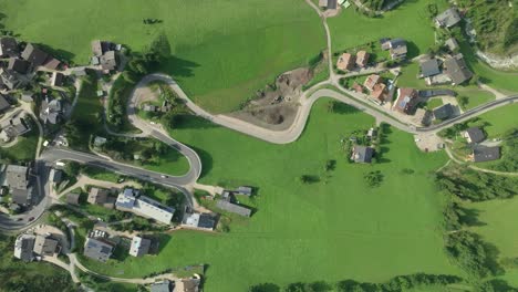 overhead view captures winding roads of la val village in italian dolomites