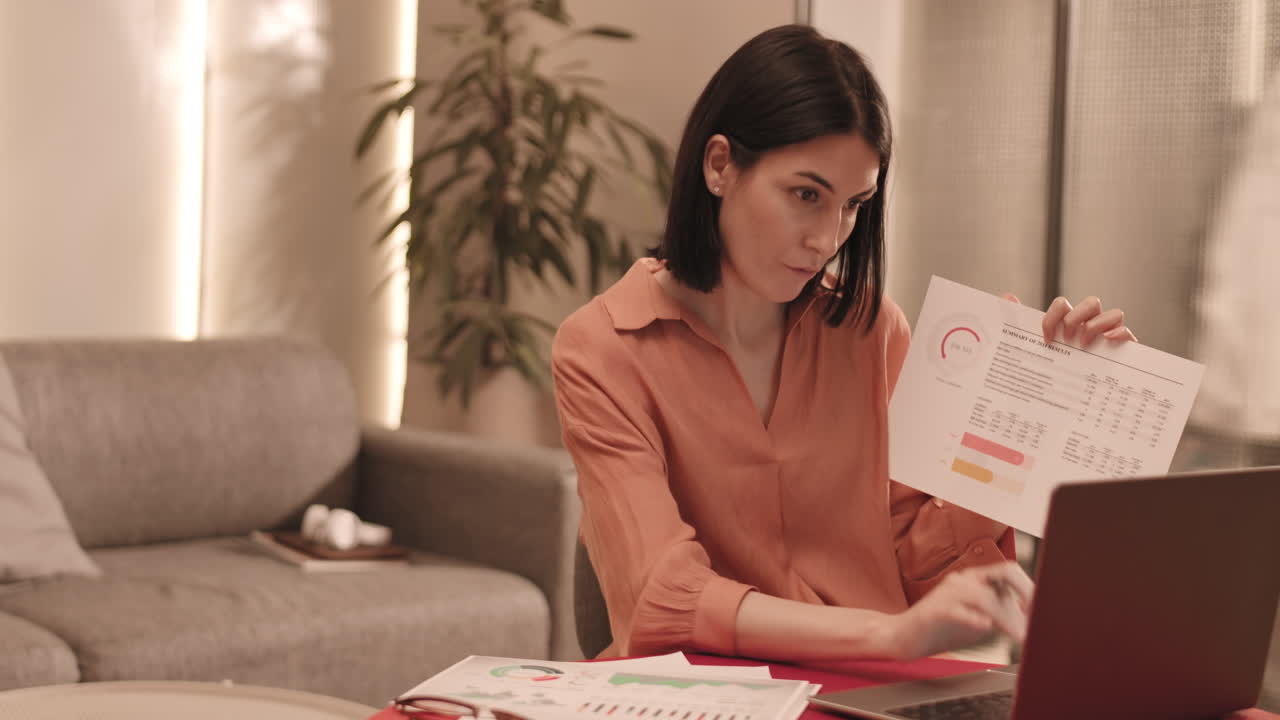 Woman Showing Charts on Camera