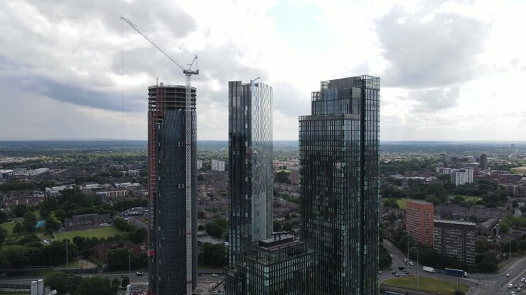 Aerial drone flight revealing a new skyscraper under construction at Elizabeth Square in Manchester City Centre