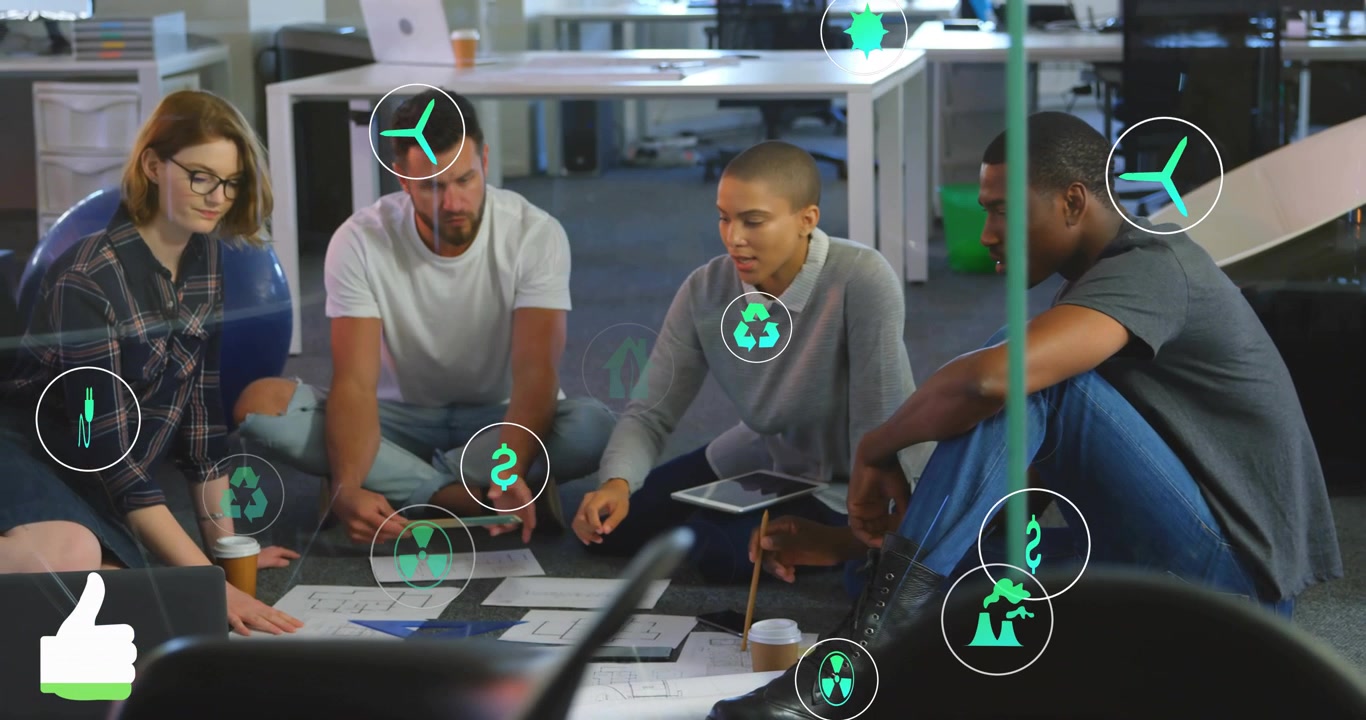 Team working on energy plans, green icons appearing and overlaying tablet and plans while pointing