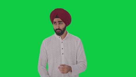 sick sikh indian man suffering from fever green screen