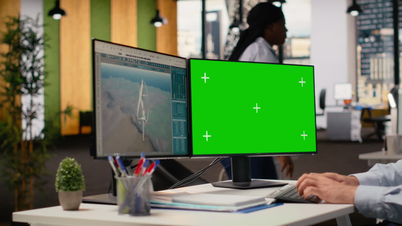 Engineer Working On Futuristic Wind Turbine Concept On Green Screen Pc