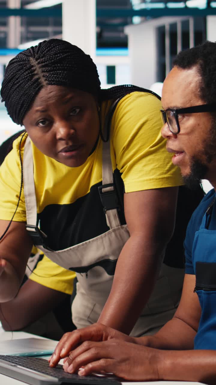 Vertical Video Black engineers collaborate on photovoltaic system designs at computers