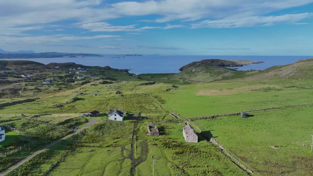 Drone footage showing Oldshoremore’s scattered cottages, green pastures, and coastline overlooking the Atlantic. Captured on a sunny day in northwest Scotland, the beauty of rural Highlands life