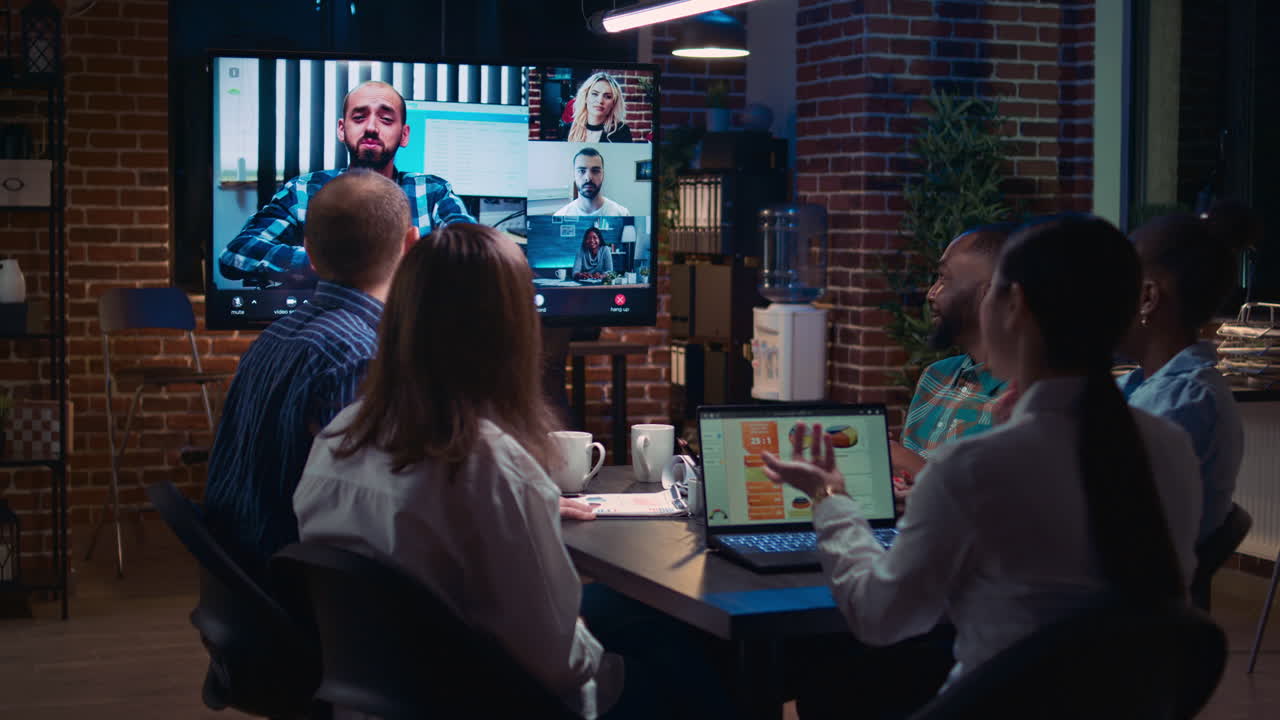 Company sales statistics discussion in remote business meeting videocall